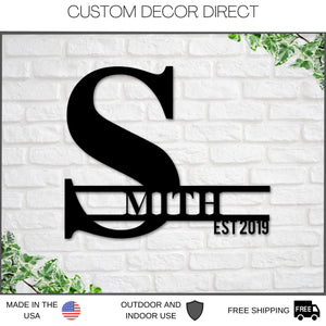Metal last name sign custom black color hanging on wall